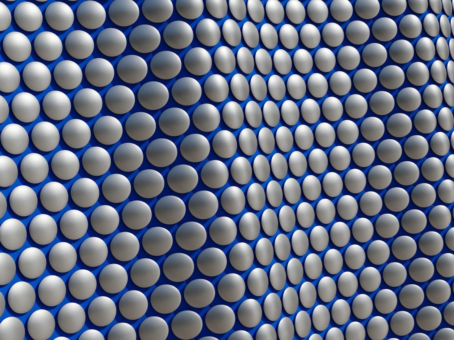 a blue and white wall with a lot of circles on it